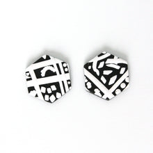 Load image into Gallery viewer, Black and white hexagon shaped earrings with an abstract modern design. Handmade from polymer clay. 3cm height 2.5cm width.
