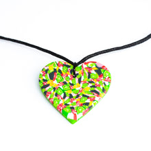 Load image into Gallery viewer, A unique heart necklace handcrafted in the UK by Bristol based Artist and Jeweller, Vicky Takooree. The distinctive multi-coloured pattern from Pink Lime Mango includes zesty green lime shapes, dark green, marbled red and white, yellow and pink elements! With an adjustable black waxed cotton cord.