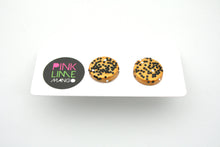 Load image into Gallery viewer, Handcrafted studs in a gold colour overlaid with iridescent glitter which shimmers between gold, green and blue. Plus a sprinkling of black and silver hexagonal glitter. Unique and one of a kind! Featuring silver plated stud posts and earring backs.