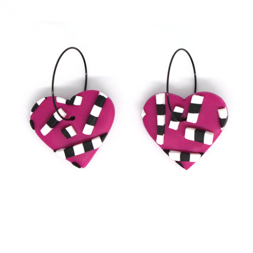 Vibrant pink hearts with 3D black and white striped detailing. Styled with stainless steel black hoops. Lightweight, handcrafted and one of a kind!
