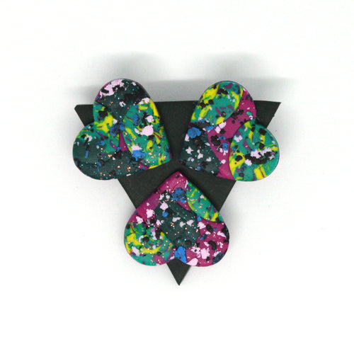 A colourful piece of wearable art! A green triangular brooch with three hearts!