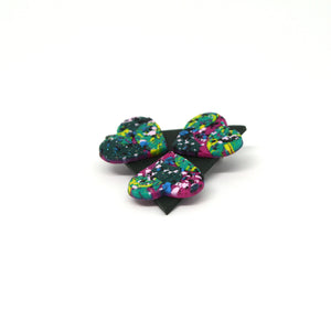 A colourful piece of wearable art! A green triangular brooch with three hearts!