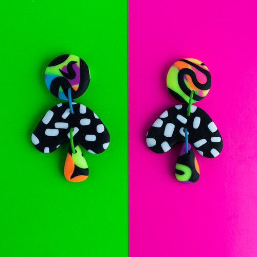 Make a statement with these awesome earrings in vibrant contrasting neon and monochrome patterns! Finished with teardrop shapes and fun colourful jump rings!