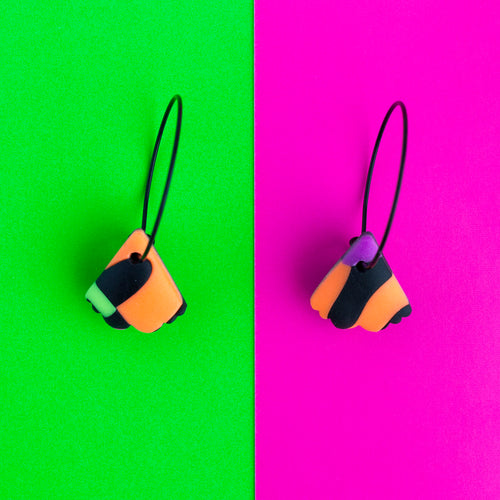 Black hoops with tiny bright colourful abstract neon and black mothwings! 