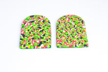Load image into Gallery viewer, Side view of arch shaped earrings with tiny green lime shapes, dark green, marbled red and white, yellow and pink colours.