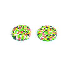 Load image into Gallery viewer, Bright bold and colourful statement studs! They are handcrafted in the UK by Bristol based Artist and Jeweller, Vicky Takooree. The distinctive multi-coloured pattern from Pink Lime Mango includes zesty green lime shapes, dark green, marbled red and white, yellow and pink elements! They are made of very lightweight polymer clay. This is a side view.
