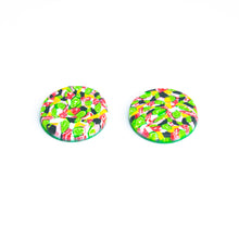Load image into Gallery viewer, Bright bold and colourful statement studs! They are handcrafted in the UK by Bristol based Artist and Jeweller, Vicky Takooree. The distinctive multi-coloured pattern from Pink Lime Mango includes zesty green lime shapes, dark green, marbled red and white, yellow and pink elements! They are made of very lightweight polymer clay. This is a side view.