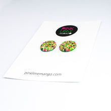 Load image into Gallery viewer, Bright bold and colourful statement studs! They are handcrafted in the UK by Bristol based Artist and Jeweller, Vicky Takooree. The distinctive multi-coloured pattern from Pink Lime Mango includes zesty green lime shapes, dark green, marbled red and white, yellow and pink elements! They are made of very lightweight polymer clay. Attached to a white backing card with the Pink Lime Mango logo at the top.
