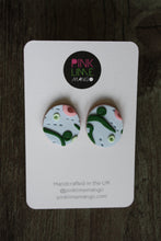 Load image into Gallery viewer, Our beautiful apple stud earrings. Inspired by a sunny walk in June through the crab apple trees. Lightweight earrings with raised and textured detailing in light blue, mint green, dark green and pink with a light brown base.