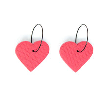 Load image into Gallery viewer, Unique handmade hoops in a beautiful blush pink colour.The textured heart earrings are handcrafted from lightweight polymer clay. Handmade by British artist, Vicky, in her home studio in Bristol, UK.
