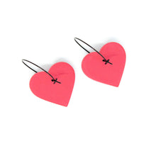 Load image into Gallery viewer, Unique handmade hoops in a beautiful blush pink colour.The textured heart earrings are handcrafted from lightweight polymer clay. Handmade by British artist, Vicky, in her home studio in Bristol, UK.