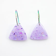 Load image into Gallery viewer, Sparkly lilac triangular earrings from the Under the Sea resin collection. Beautiful layers of fine iridescent glitter, colour shifting aurora flakes and tiny pieces of metallic purple foil. A unique design that has been complimented with multicoloured rainbow hoops!