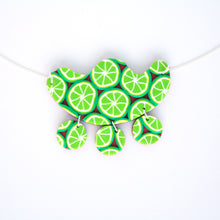 Load image into Gallery viewer, Measurements: 7cm width x 5.5cm height Each design is exclusively unique! Featuring an 18 inch (approx. 45cm) sterling silver chain Our vibrant Pink Lime Mango necklace has a retro feel! This is a one of a kind statement necklace with a triple disc drop complete with a sterling silver chain!