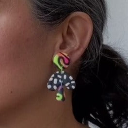 A video still of Vicky from Pink Lime Mango modelling handcrafted earrings for size reference. Bright, bold and colourful Neon Drops earrings made in Bristol UK