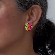 Load image into Gallery viewer, A video still of Vicky from Pink Lime Mango modelling handcrafted Neon Statement Studs for size reference. Bright, bold and colourful earrings made in Bristol UK