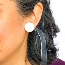Load image into Gallery viewer, handcrafted bubble-gum pink resin statement studs. They contain the most amazing aurora glitter flakes. Colour changing iridescent pieces which shine when they catch the light. The earrings posts are made of sterling silver. model shot
