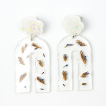 Load image into Gallery viewer, Handcrafted earrings with arches of clear resin containing sea lavender flowers. The stud top is a white flower containing the most wonderful colourful changing aurora flakes of glitter.