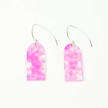 Load image into Gallery viewer, Delicate arches of clear resin with bursts of pale pink and tiny shimmery flower sequins. The unique V shaped earring hooks are made of sterling silver.