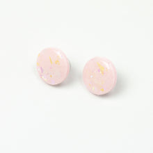 Load image into Gallery viewer, handcrafted bubble-gum pink resin statement studs. They contain the most amazing aurora glitter flakes. Colour changing iridescent pieces which shine when they catch the light. The earrings posts are made of sterling silver.