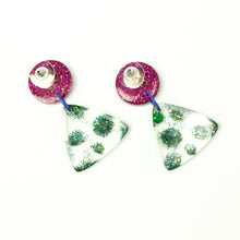 Load image into Gallery viewer, Earring backs. Handcrafted resin earrings decorated with teal blue and purple glitter. The round stud top has a been jam packed with gorgeous sparkly purple glitter while the base has spots of glitter interspersed throughout the clear resin triangle shape!