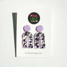 Load image into Gallery viewer, Gorgeous handcrafted resin earrings with round glittery lilac stud tops! These beautiful arch dangle earrings are decorated with delicate pieces of silver and purple foils. Pictured with a Pink Lime Mango earring backing card.