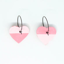 Load image into Gallery viewer, Bright, bold and colourful handcrafted earrings from Pink Lime Mango. Split Heart Hoops. One half is pale pink, and the other half is a lighter pink with tiny red hearts.