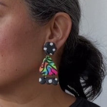 Load image into Gallery viewer, A video still of Vicky from Pink Lime Mango modelling handcrafted Super Neon Sisters earrings for size reference. Bright, bold and colourful earrings made in Bristol UK