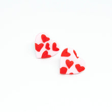 Load image into Gallery viewer, Pink and red mini heart studs. A pale pink base heart with tiny red hearts overlaid to give a slightly raised textured pattern.