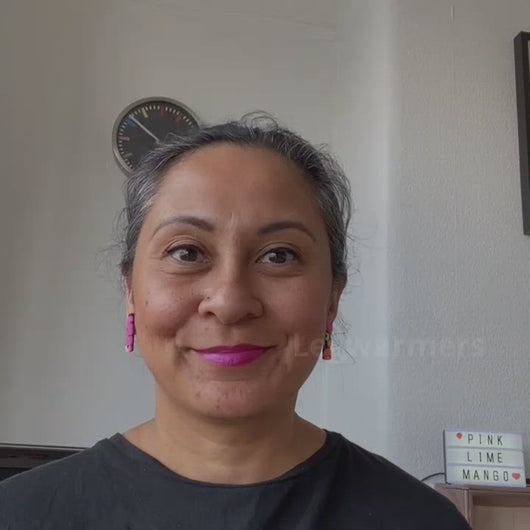 A video clip of Vicky from Pink Lime Mango modelling handcrafted Legwarmers earrings for size reference. Bright, bold and colourful earrings made in Bristol UK