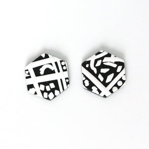 Black and white hexagon shaped earrings with an abstract modern design. Handmade from polymer clay. 3cm height 2.5cm width.