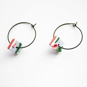 Delicate rectangles in our Apple design adorn the black stainless steel hoops!