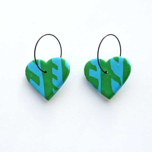 Beautiful blue and green patterned hearts with stainless steel black hoops. Lightweight, handcrafted and one of a kind!