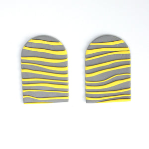 These are the stunning Hope Arches. Waves of bright yellow against a grey background. I love the raised texture of these pieces. So tactile!  The fronts of the earrings have yellow waves which are slightly raised against the grey background. In contrast, the backs of the earrings are velvety soft against your skin.