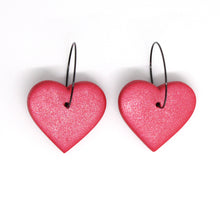 Load image into Gallery viewer, Beautiful vibrant red glitter hearts with stainless steel black hoops. Lightweight, handcrafted and one of a kind!
