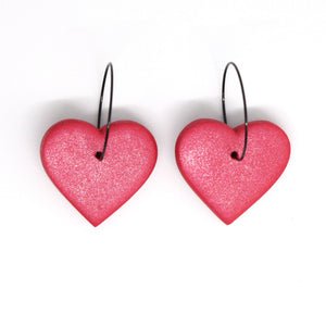 Beautiful vibrant red glitter hearts with stainless steel black hoops. Lightweight, handcrafted and one of a kind!