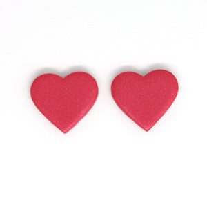 Small red glitter hearts. Featuring silver plated stud posts and backs. Handcrafted and one of a kind!