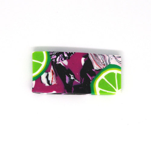 A wonderful statement piece of wearable art! A unique rectangular shaped brooch that has a pop art fusion with colourful limes.