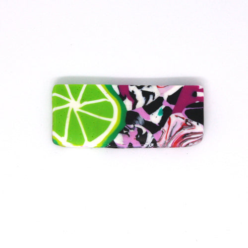 A wonderful statement piece of wearable art! A unique rectangular shaped brooch that has a pop art fusion with colourful limes.