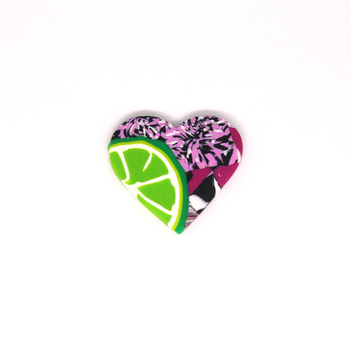 A wonderful statement piece of wearable art! A unique heart shaped brooch that has a pop art fusion with colourful limes.