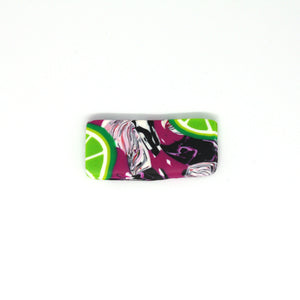 A wonderful statement piece of wearable art! A unique rectangular shaped brooch that has a pop art fusion with colourful limes.