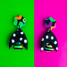 Load image into Gallery viewer, Status Earrings Collection! Unique and vibrant dangle earrings which have neon flower stud tops, black and white moth wings in the middle and mini stripy moth wings at the bottom!
