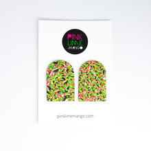 Load image into Gallery viewer, These stunning statement arch shaped earrings are adorned with tiny green lime shapes, dark green, marbled red and white, yellow and pink colours. There are attached to a white backing card with the Pink Lime Mango logo.

