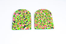 Load image into Gallery viewer, Side view of arch shaped earrings with tiny green lime shapes, dark green, marbled red and white, yellow and pink colours. 
