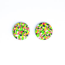 Load image into Gallery viewer, Bright bold and colourful statement studs! They are handcrafted in the UK by Bristol based Artist and Jeweller, Vicky Takooree. The distinctive multi-coloured pattern from Pink Lime Mango includes zesty green lime shapes, dark green, marbled red and white, yellow and pink elements! They are made of very lightweight polymer clay.
