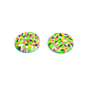 Bright bold and colourful statement studs! They are handcrafted in the UK by Bristol based Artist and Jeweller, Vicky Takooree. The distinctive multi-coloured pattern from Pink Lime Mango includes zesty green lime shapes, dark green, marbled red and white, yellow and pink elements! They are made of very lightweight polymer clay. This is a side view.