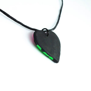The back of the pendant which is plain black.