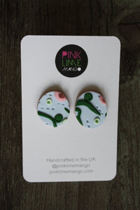 Our beautiful apple stud earrings. Inspired by a sunny walk in June through the crab apple trees. Lightweight earrings with raised and textured detailing in light blue, mint green, dark green and pink with a light brown base.