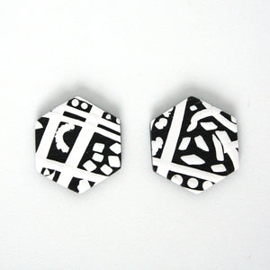Black and white hexagon shaped earrings with an abstract modern design. Handmade from polymer clay. 3cm height 2.5cm width.