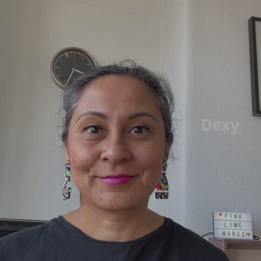A video of Vicky from Pink Lime Mango modelling handcrafted Dexy earrings for size reference. Bright, bold and colourful earrings made in Bristol UK