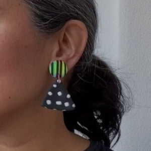 A video still of Vicky from Pink Lime Mango modelling handcrafted earrings for size reference. Bright, bold and colourful Dial Up earrings made in Bristol UK